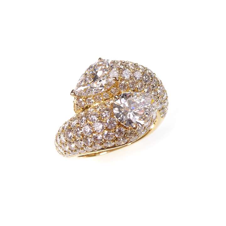 Pear shaped diamond two-stone crossover ring